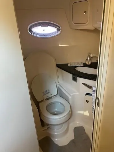  Yacht Photos Pics 2003 Sea Ray 420 Sundancer bathroom with toilet and sink.