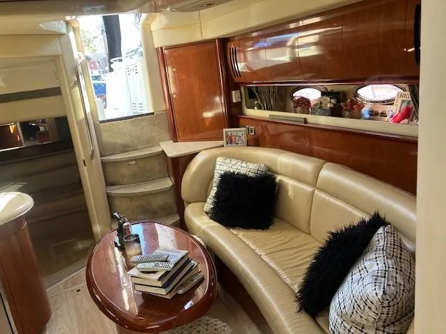  Yacht Photos Pics Luxurious interior of 2003 Sea Ray 420 Sundancer yacht with plush seating and elegant decor.