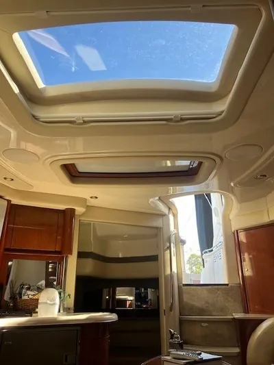  Yacht Photos Pics Interior view of 2003 Sea Ray 420 Sundancer with skylight and modern amenities.