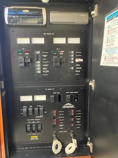  Yacht Photos Pics Electrical panel of 2003 Sea Ray 420 Sundancer boat with control switches and stereo system.