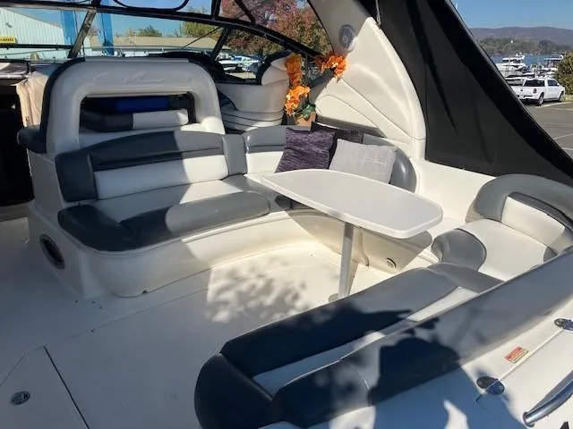  Yacht Photos Pics 2003 Sea Ray 420 Sundancer interior with seating and table, featuring modern design and comfort.