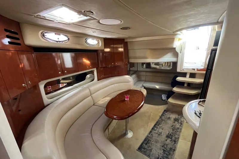 Jus A Lil' Yacht Photos Pics Luxurious interior of 2003 Searay 380 yacht with plush seating and elegant wood finishes.