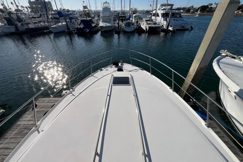 Jus A Lil' Yacht Photos Pics 2003 Searay 380 yacht docked at marina with sparkling water and boats.