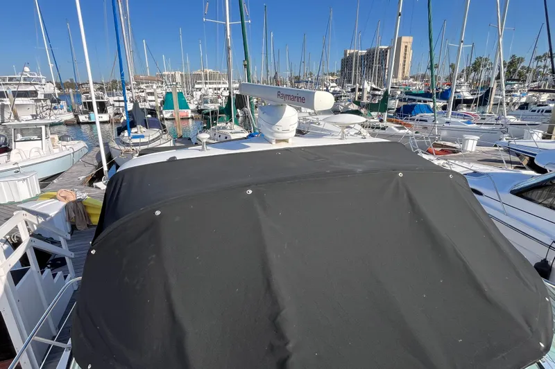 Jus A Lil' Yacht Photos Pics 2003 Searay 380 yacht docked in a busy marina with numerous sailboats.