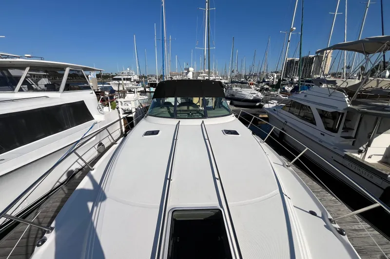Jus A Lil' Yacht Photos Pics 2003 Searay 380 yacht docked at a marina, surrounded by other boats.