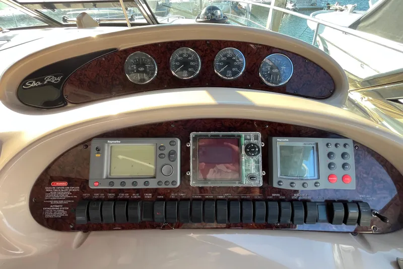 Jus A Lil' Yacht Photos Pics Control panel of a 2003 Searay 380 boat with navigation instruments.
