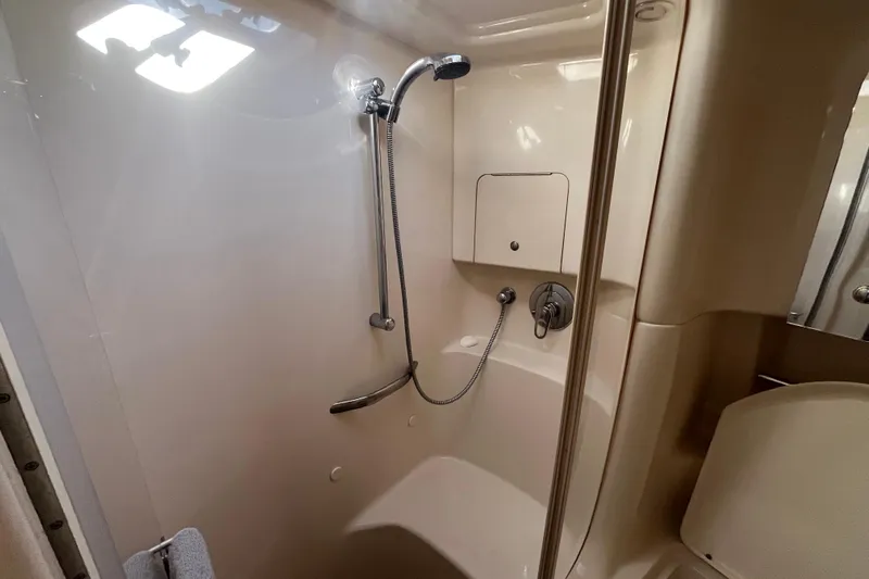 Jus A Lil' Yacht Photos Pics 2003 Searay 380 yacht bathroom with shower, featuring sleek design and modern fixtures.