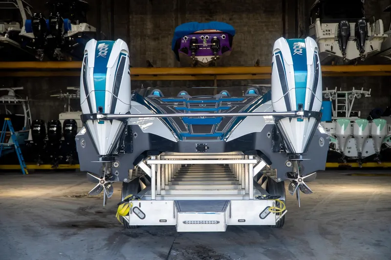  Yacht Photos Pics 2024 MTI 440X powerboat with dual engines in a storage facility.