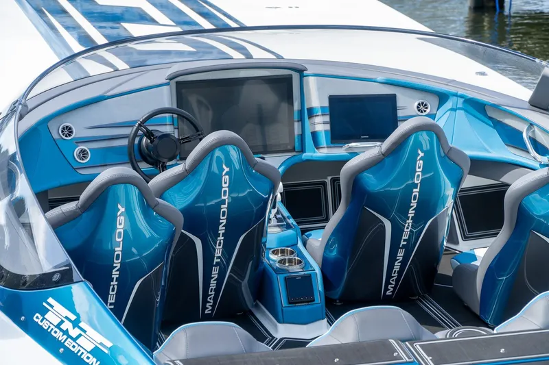  Yacht Photos Pics 2024 MTI 440X boat interior with advanced navigation system and sleek blue design.