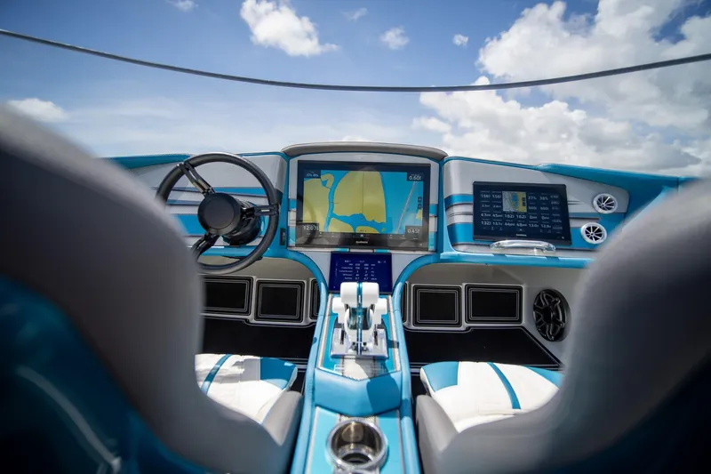  Yacht Photos Pics 2024 MTI 440X boat cockpit with advanced navigation displays and steering wheel.