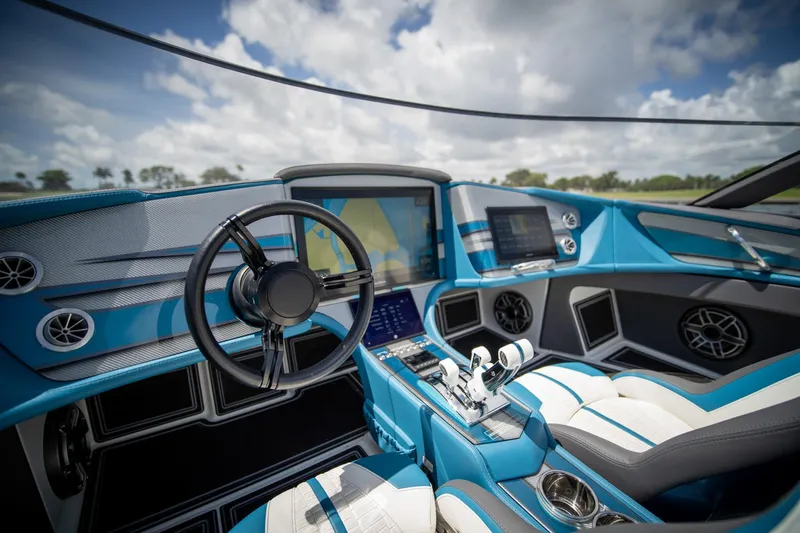  Yacht Photos Pics 2024 MTI 440X boat interior with modern dashboard, steering wheel, and advanced navigation systems.