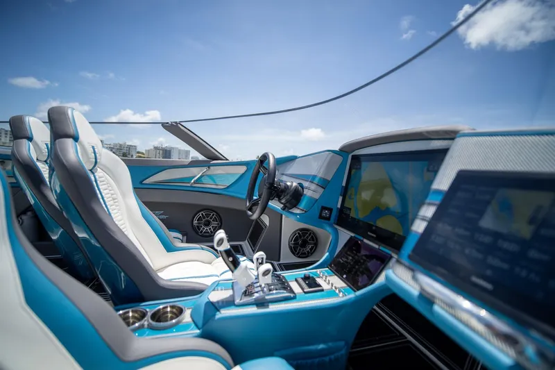  Yacht Photos Pics Interior of 2024 MTI 440X boat with modern controls and blue accents.