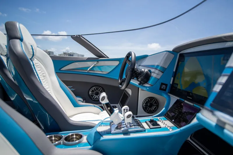  Yacht Photos Pics Interior of 2024 MTI 440X boat, featuring modern controls and luxurious seating.