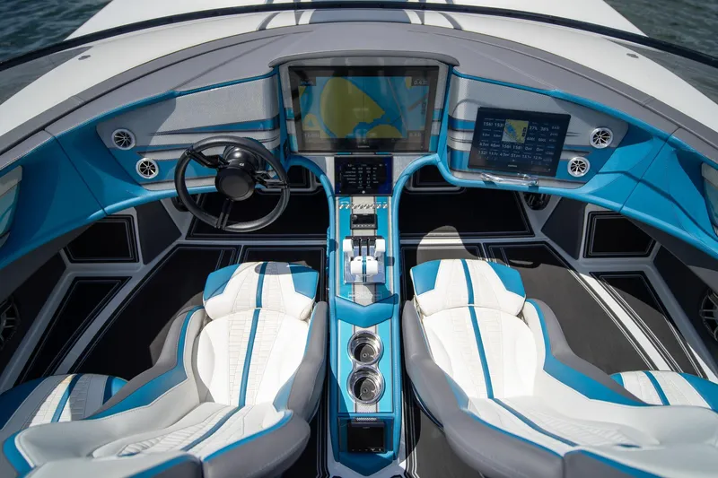  Yacht Photos Pics 2024 MTI 440X boat cockpit with advanced navigation screens and luxurious seating.