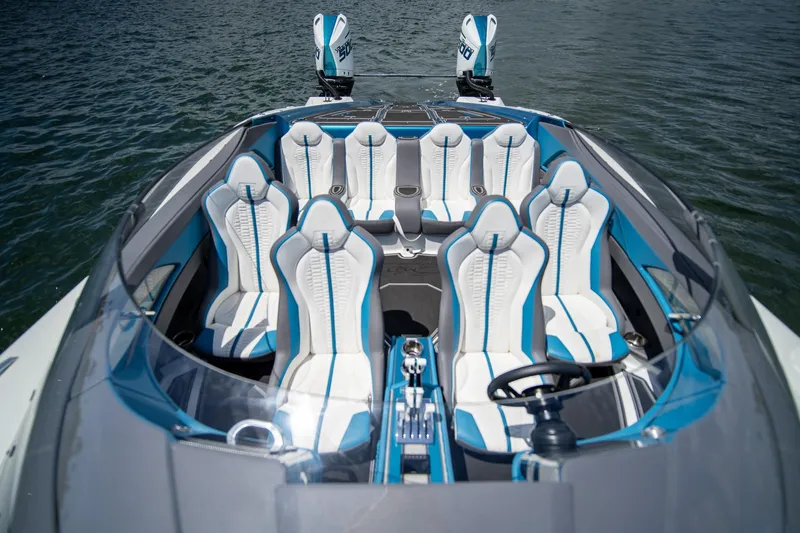  Yacht Photos Pics 2024 MTI 440X boat interior with blue and white seating, on water.