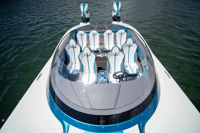  Yacht Photos Pics 2024 MTI 440X speedboat with sleek design and luxurious seating on the water.