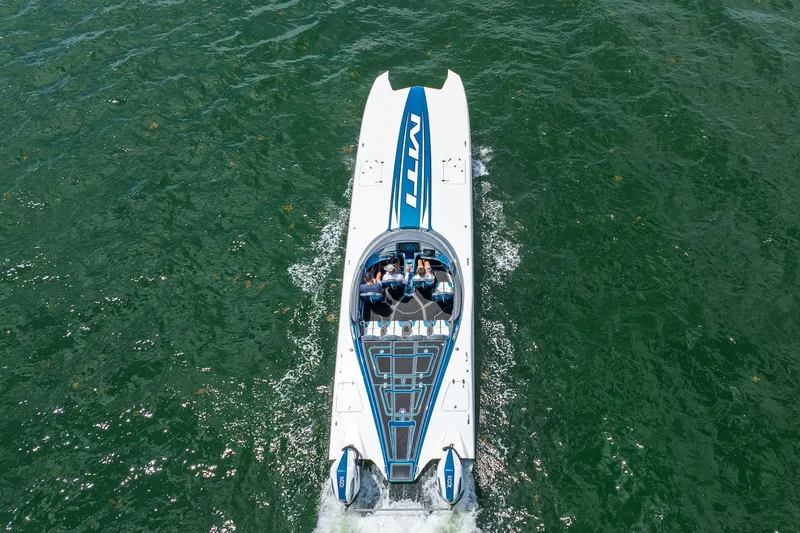  Yacht Photos Pics 2024 MTI 440X speedboat cruising on open water, aerial view.