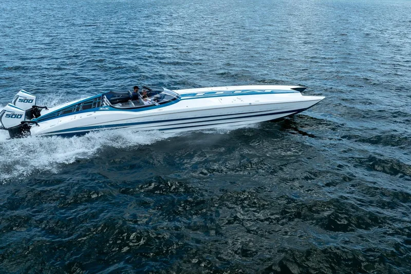 Yacht Photos Pics 2024 MTI 440X speedboat cruising on open water, featuring dual 500 engines.