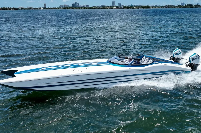  Yacht Photos Pics 2024 MTI 440X speedboat cruising on open water with twin engines.