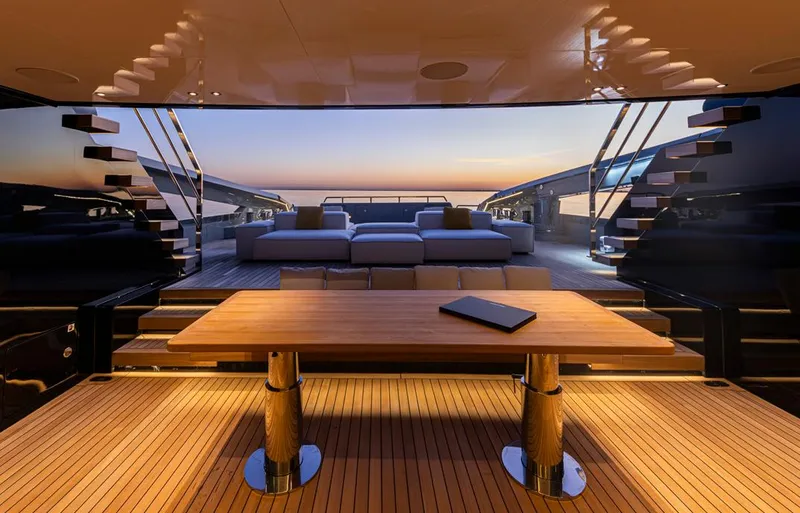 Doge 400 Yacht Photos Pics Luxurious Ocean King Doge 400 yacht interior with sunset view, featuring elegant wooden table, 2027 model.