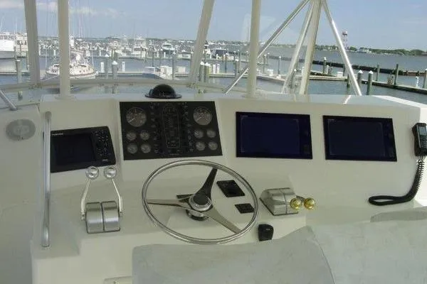  Yacht Photos Pics Helm of 1996 Viking 50 Convertible yacht with marina view.