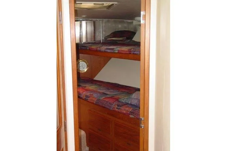  Yacht Photos Pics Bunk beds in 1996 Viking 50 Convertible yacht cabin with wooden finish.