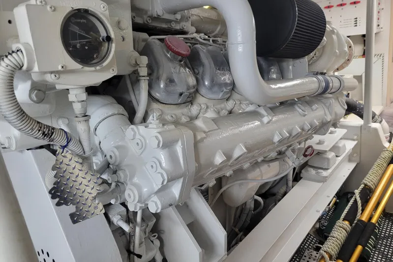  Yacht Photos Pics Engine room of a 1996 Viking 50 Convertible yacht, showcasing detailed machinery components.