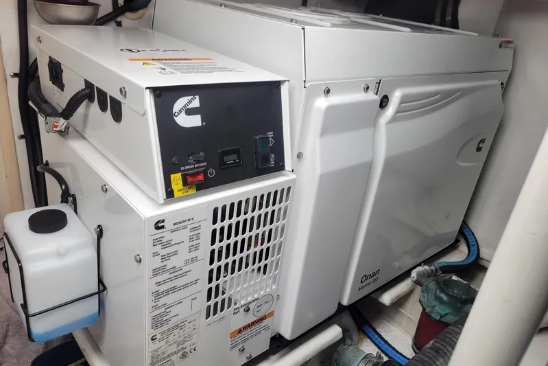  Yacht Photos Pics Cummins Onan marine generator in a 1996 Viking 50 Convertible yacht engine room.