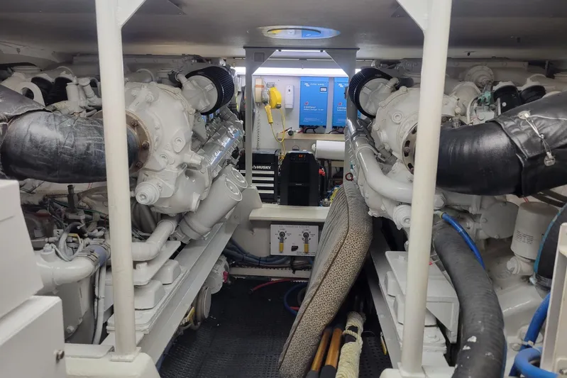  Yacht Photos Pics Engine room of a 1996 Viking 50 Convertible yacht, showcasing dual engines and equipment.