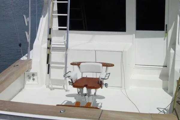  Yacht Photos Pics 1996 Viking 50 Convertible yacht deck with fishing chair and ladder.
