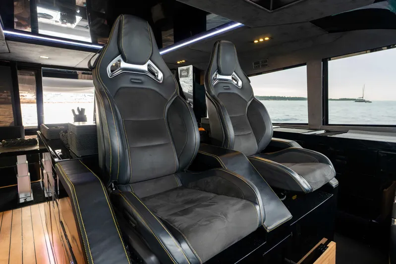 Matariki Yacht Photos Pics Luxurious interior of 2014 Maori 78 yacht with sleek black seating and ocean view.