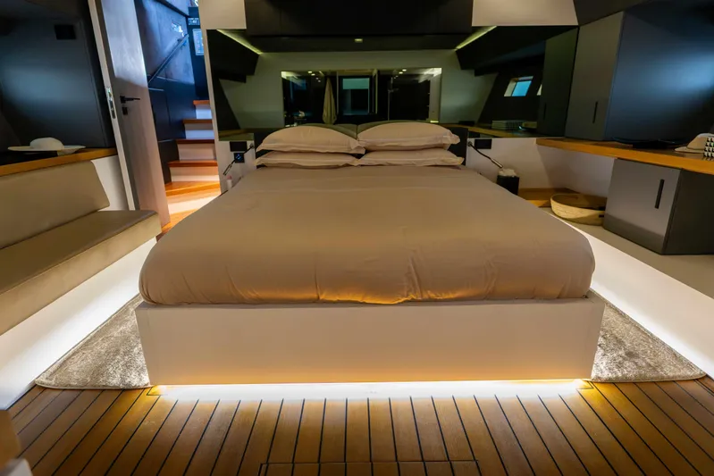Matariki Yacht Photos Pics Luxurious bedroom interior on Maori 78 yacht, 2014 model, featuring modern design and ambient lighting.