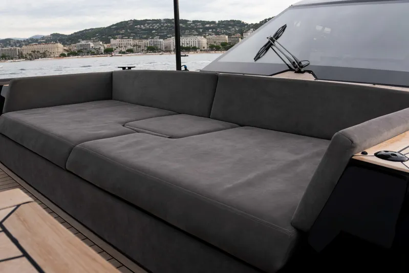 Matariki Yacht Photos Pics Luxurious seating on Maori 78 yacht, 2014 model, with scenic coastal backdrop.