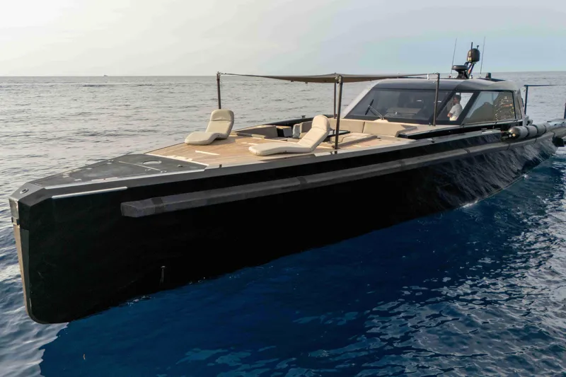 Matariki Yacht Photos Pics Luxurious 2014 Maori 78 yacht cruising on open sea with sleek design and sun loungers.