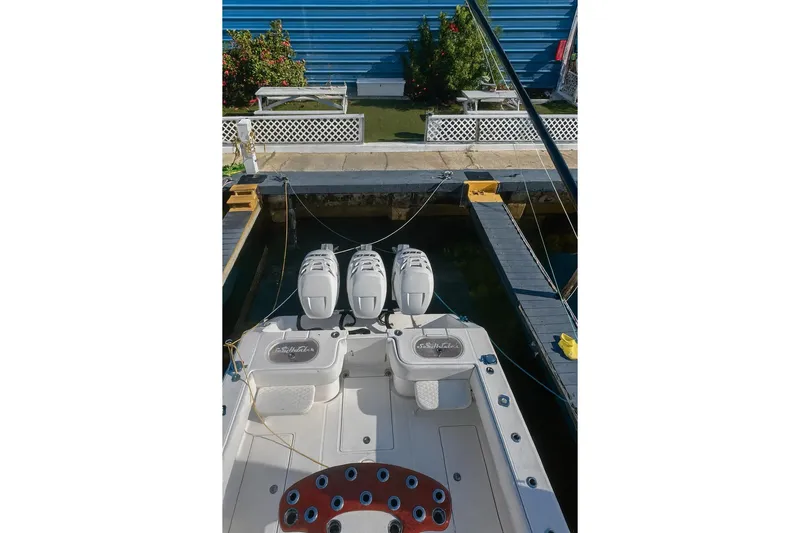  Yacht Photos Pics 2017 Sea Hunter 39 boat docked with triple outboard engines, viewed from above.