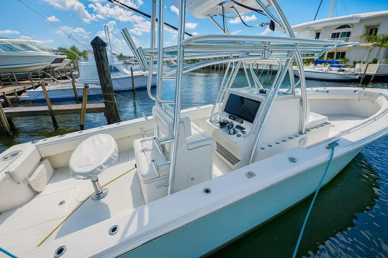 Yacht Photos Pics 2017 Sea Hunter 39 boat with sleek design, docked in a marina under a sunny sky.