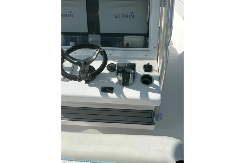  Yacht Photos Pics 2017 Sea Hunter 39 boat helm with Garmin navigation system and steering wheel.