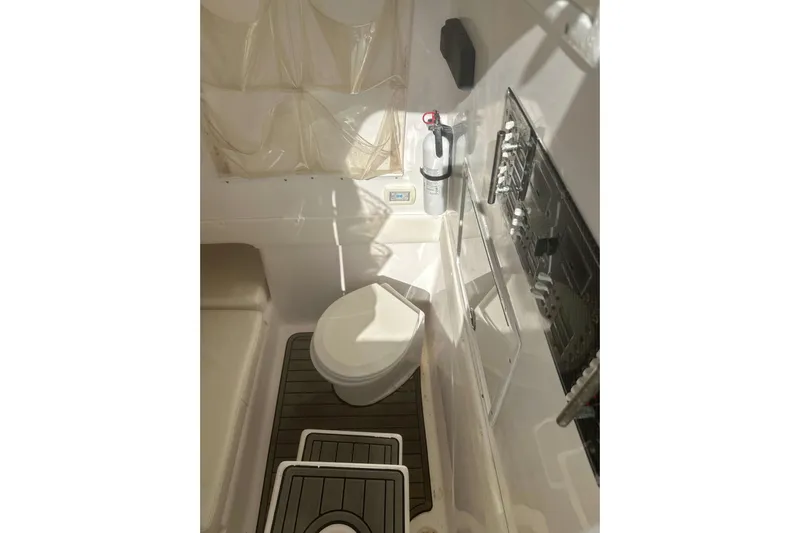  Yacht Photos Pics Interior of 2017 Sea Hunter 39 boat featuring a compact marine toilet setup.