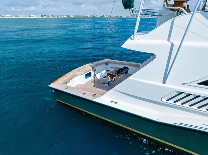 Typhoon I Yacht Photos Pics 2008 Tribute Sportfish boat on calm blue ocean waters.