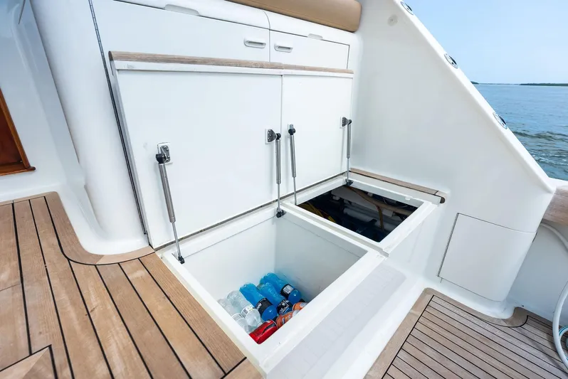 Typhoon I Yacht Photos Pics 2008 Tribute Sportfish boat with open storage compartments and beverages inside.