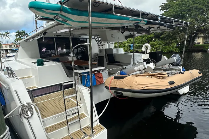 Big Enough Yacht Photos Pics 2014 Fountaine Pajot Helia 44 catamaran docked with paddleboard and dinghy.