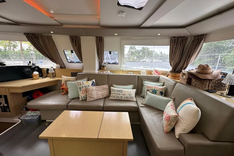 Big Enough Yacht Photos Pics Luxurious interior of 2014 Fountaine Pajot Helia 44 catamaran with cozy seating and decorative pillows.