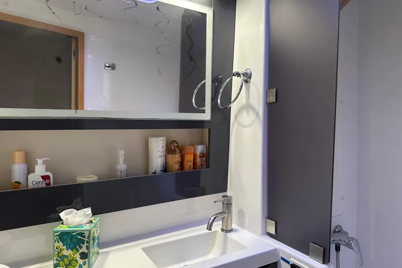 Big Enough Yacht Photos Pics Bathroom interior of 2014 Fountaine Pajot Helia 44 catamaran with modern fixtures and toiletries.