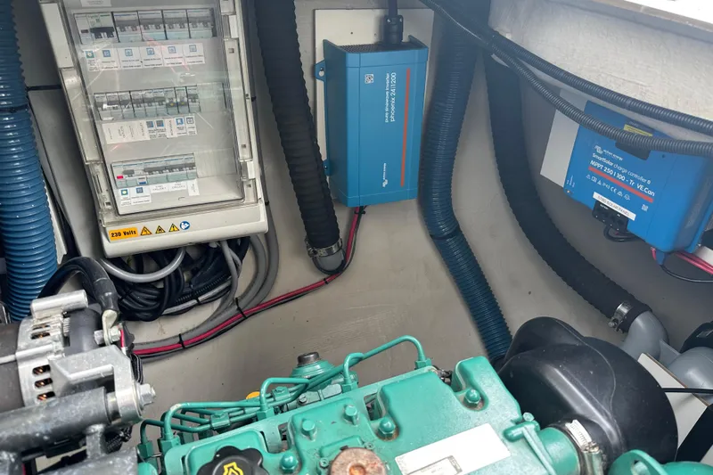 Big Enough Yacht Photos Pics Engine room of 2014 Fountaine Pajot Helia 44 with electrical components and wiring.