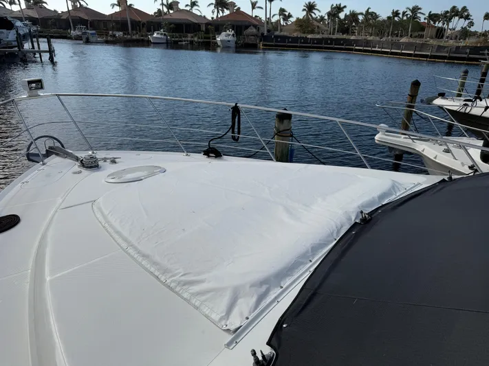  Yacht Photos Pics 2002 Carver 530 Voyager Pilothouse yacht docked in a marina, with covered deck.