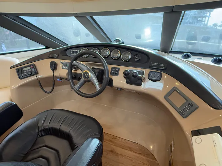  Yacht Photos Pics Pilothouse interior of 2002 Carver 530 Voyager, featuring steering wheel and control panel.