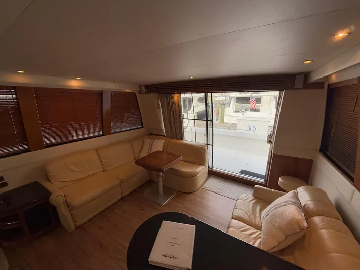  Yacht Photos Pics Interior of 2002 Carver 530 Voyager Pilothouse with beige seating and wooden accents.