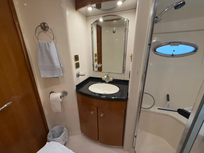  Yacht Photos Pics Bathroom interior of 2002 Carver 530 Voyager Pilothouse yacht, featuring sink and shower.