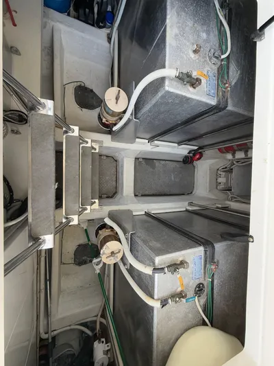  Yacht Photos Pics Engine room of 2002 Carver 530 Voyager Pilothouse with visible fuel tanks and piping.