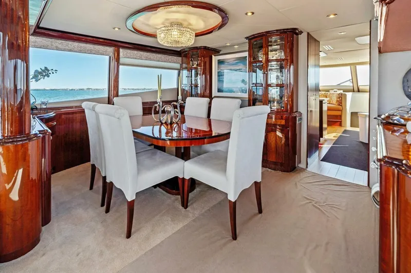 Summerwind Yacht Photos Pics Luxurious dining area on a 2005 Lazarra 80 yacht with elegant furnishings and ocean view.